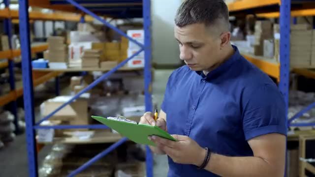 A carrier's paperwork and cargo being checked against a manifest